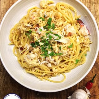 A bowl of spaghetti with crab meat
