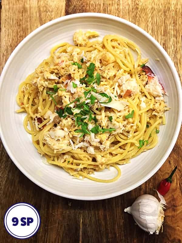 A bowl of spaghetti with crab meat