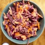 A close up picture of a bowl of coleslaw