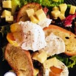 Lyonnaise salad with poached eggs, croutons, bacon and cheese