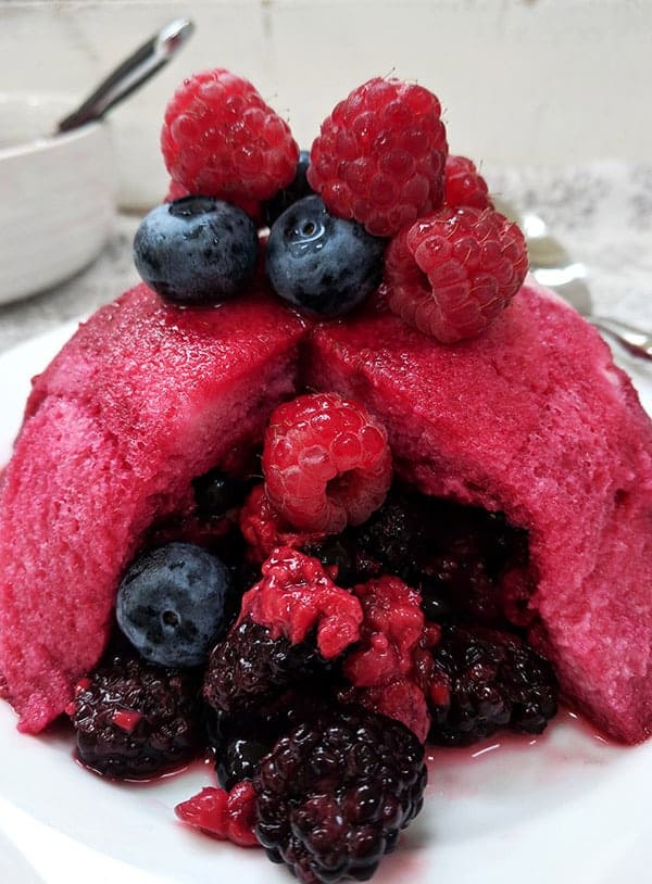 A close up of summer pudding with fresh fruit