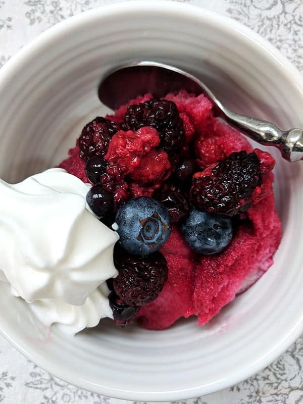 A bowl of summer pudding and cream