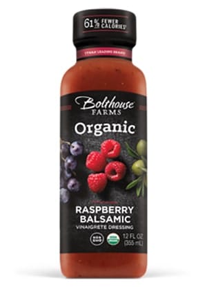 A bottle of Bolthouse farms organic raspberry dressing