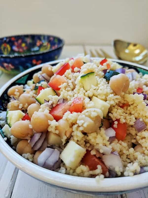 A close up of a bowl of couscous salad