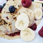 A close up of some berry pancakes