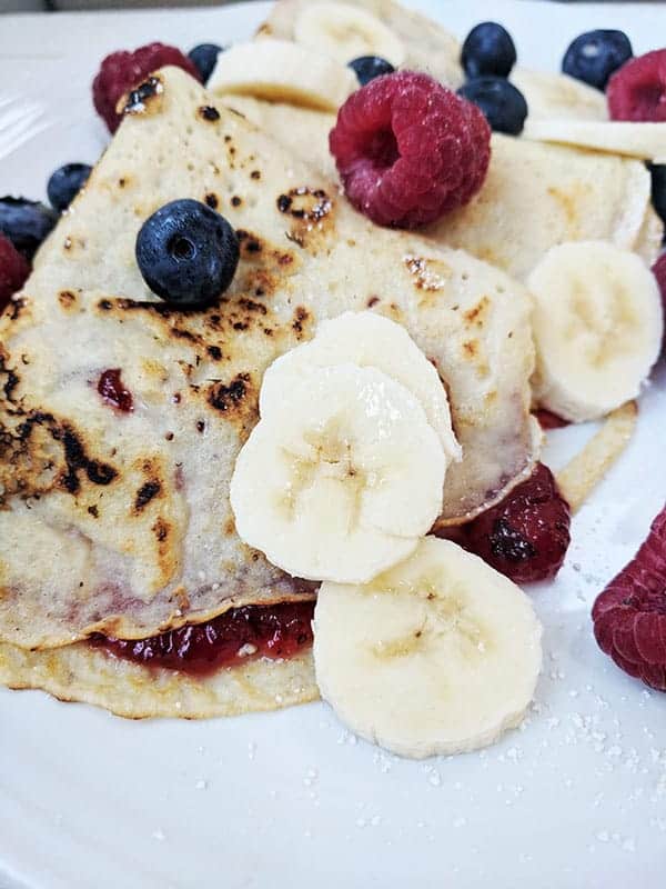 A close up of some berry pancakes