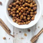 A bowl of honey roasted chickpeas with cinnamon and honey