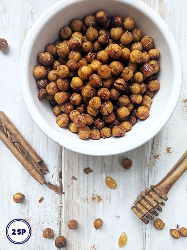 A bowl of honey roasted chickpeas with cinnamon and honey