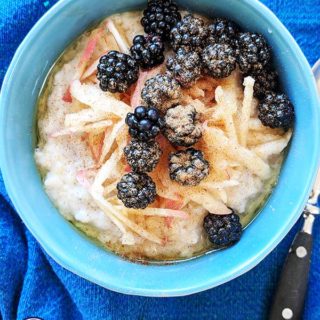 A blue bowl of Blackberry & Apple Porridge