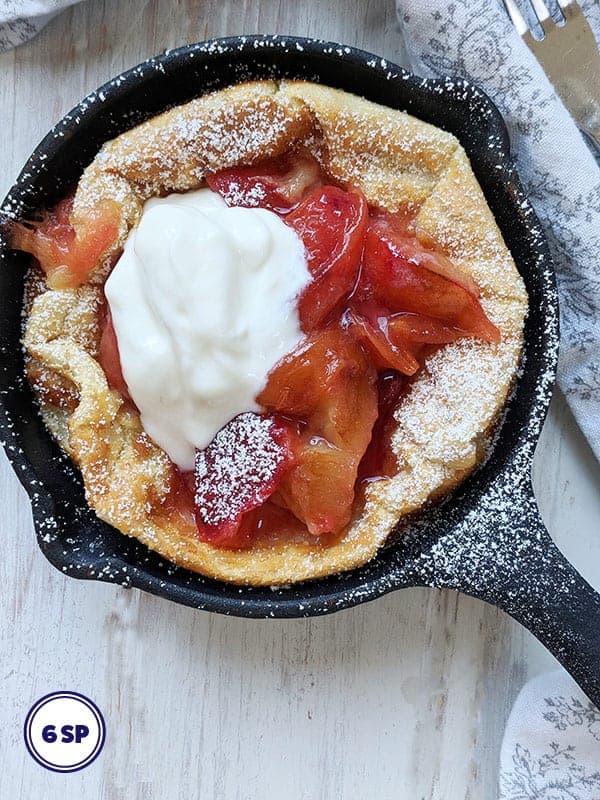 A dutch baby pancake in a skillet