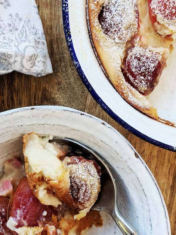 A close up of a dish of plum clafoutis