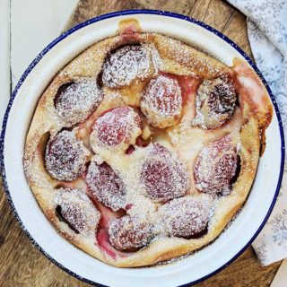 A dish with plum clafoutis