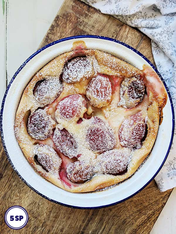 A dish with plum clafoutis