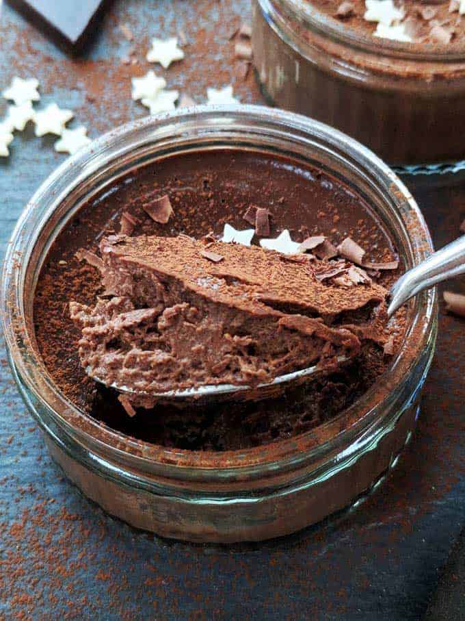 A chocolate pot on a dark table