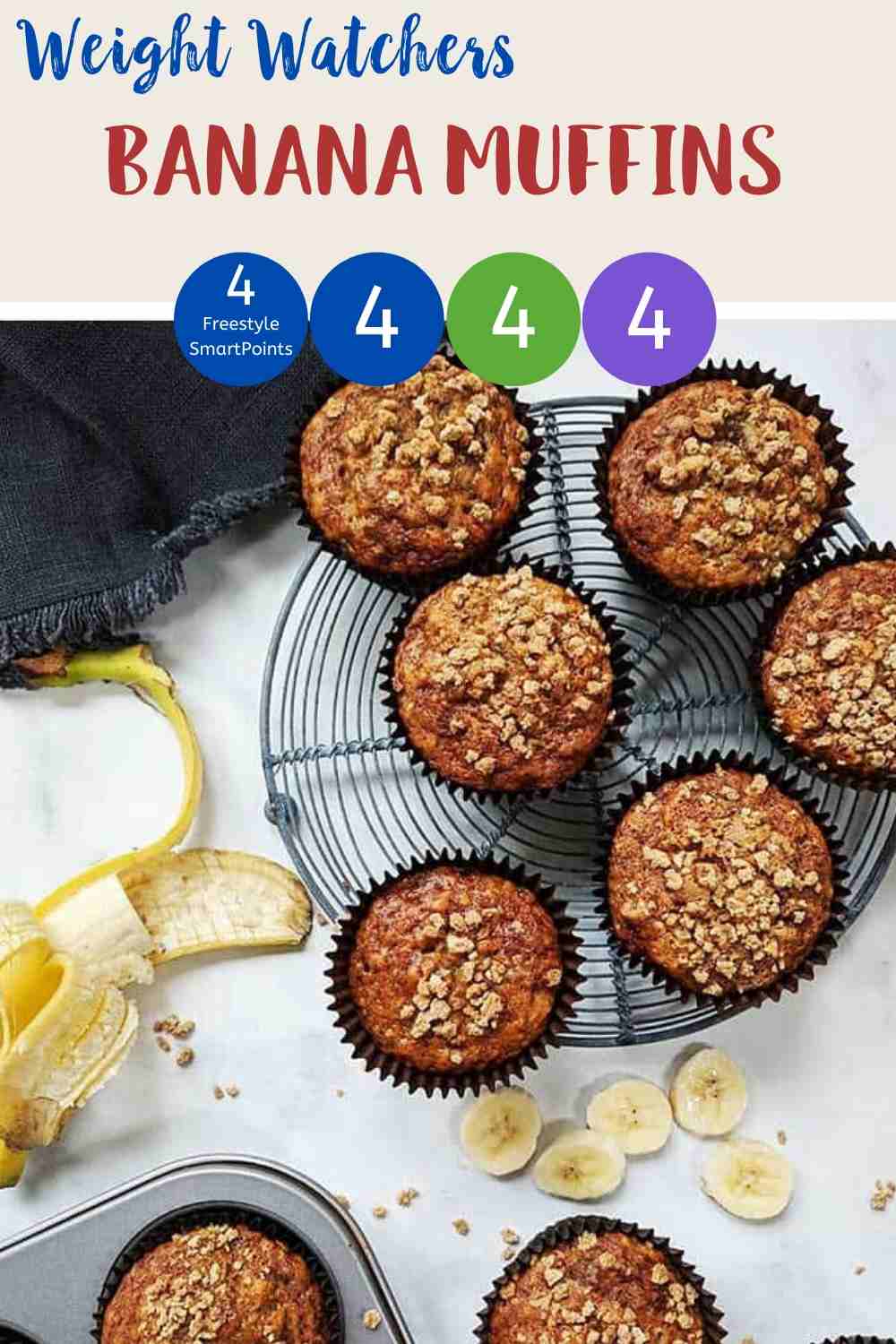 Banana Muffins on a wire rack with a peeled banana along side