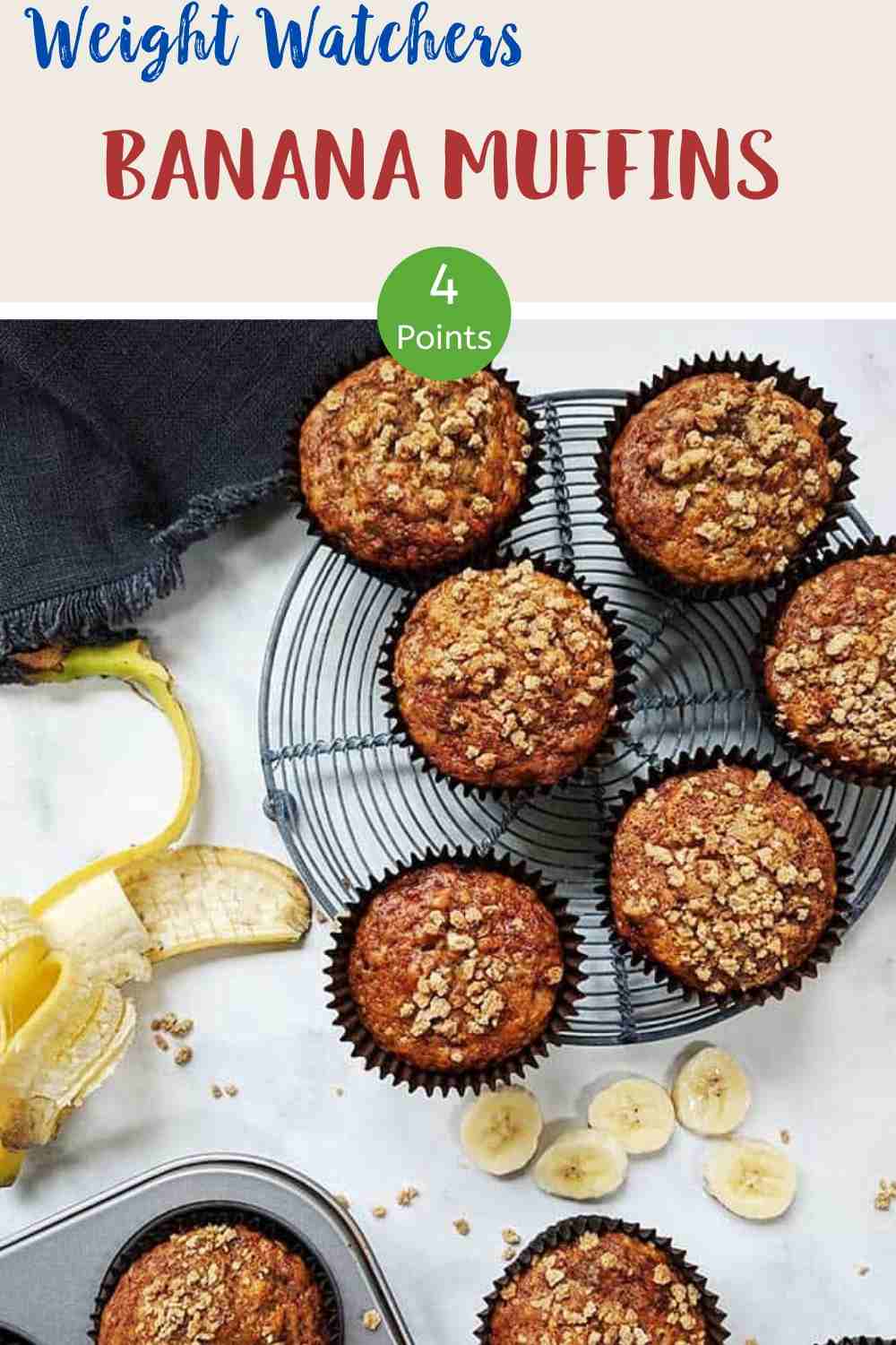 Banana Muffins on a wire rack with a peeled banana along side