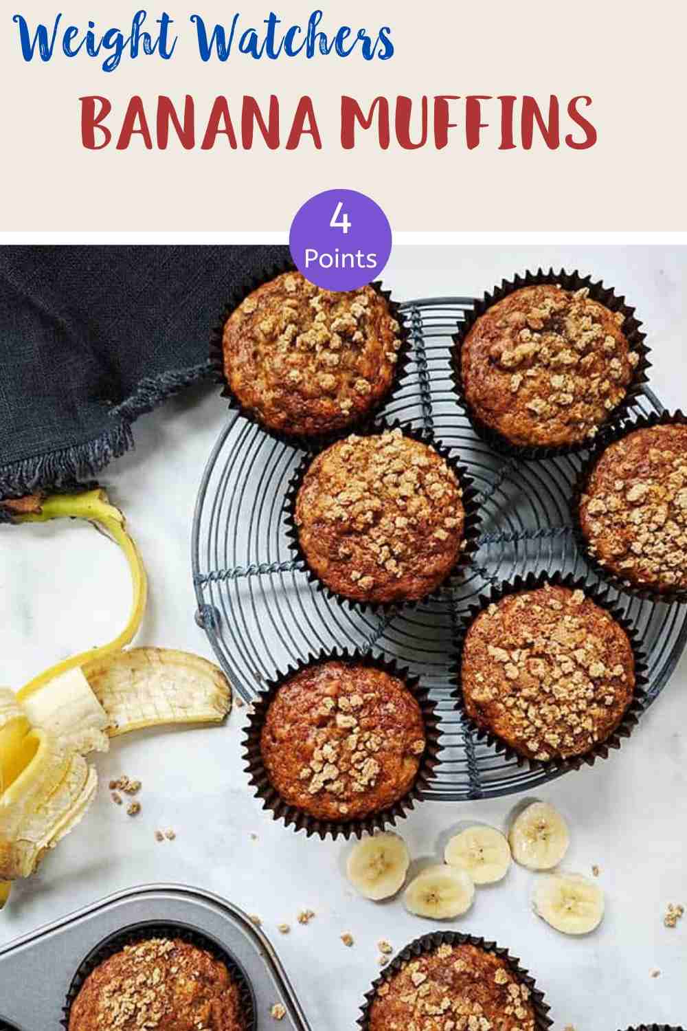 Banana Muffins on a wire rack with a peeled banana along side