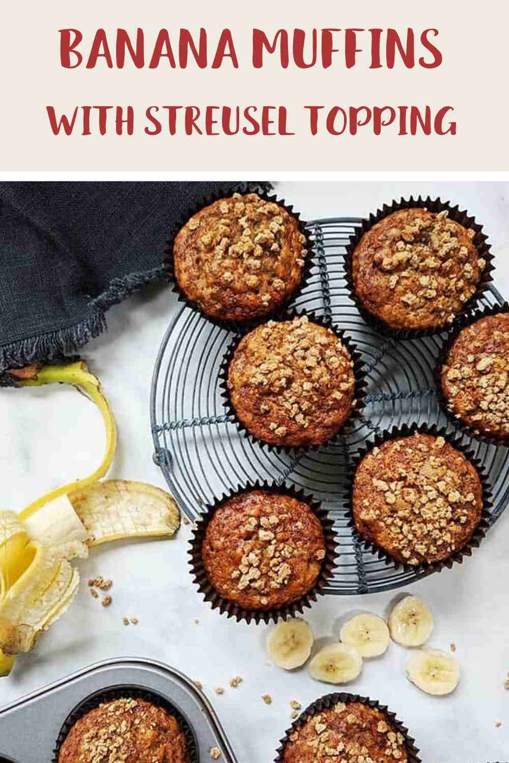 Banana Muffins on a wire rack with a peeled banana along side