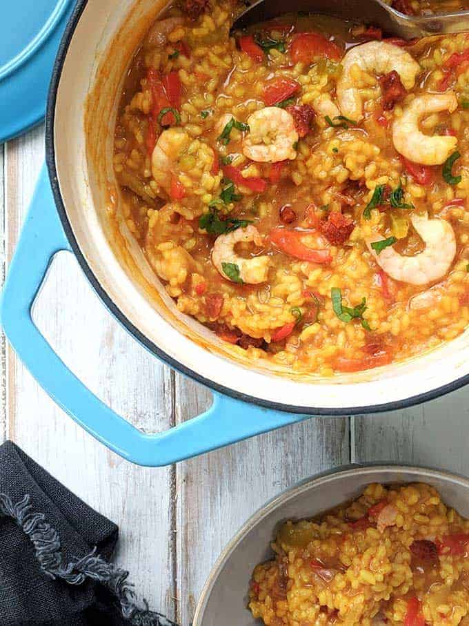 A casserole dish of Shrimp, chorizo and red pepper paella | weight watchers