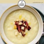 A bowl of weight watchers celeriac soup with crunchy bacon and croutons