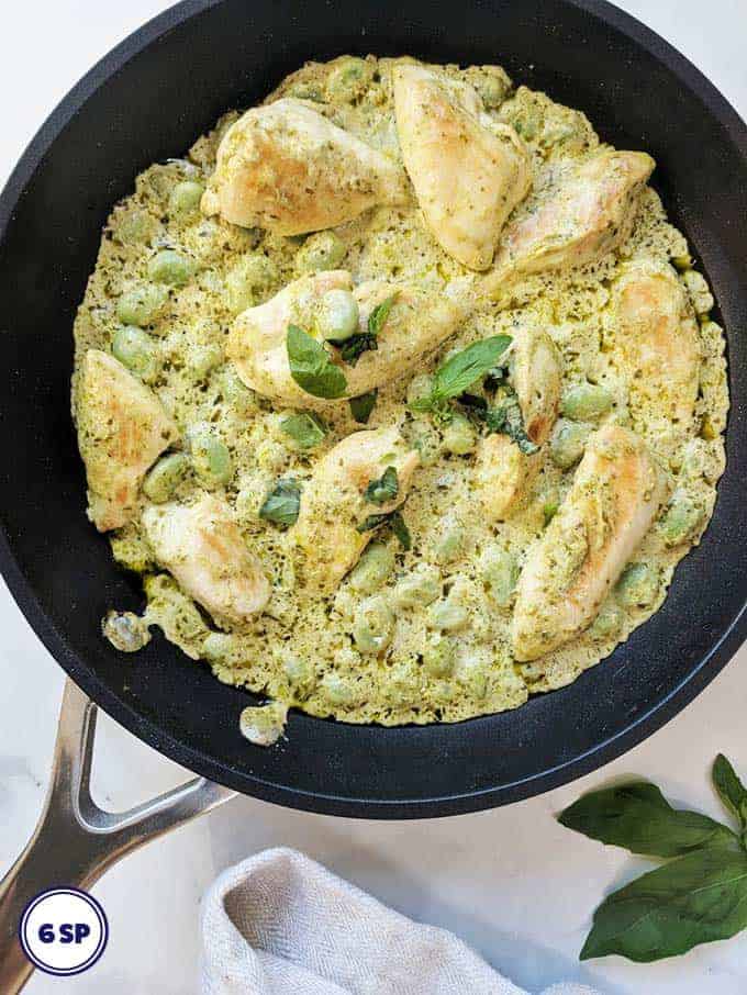 A skillet of Creamy Pesto Chicken with Broad Beans | weight watchers