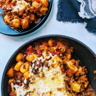 A skillet of spicy ragu gnocchi