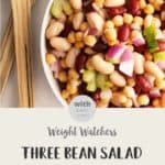 WW Three Bean Salad in a white bowl with salad servers