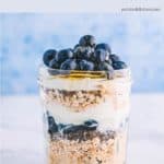 A jar of overnight oats with blueberries