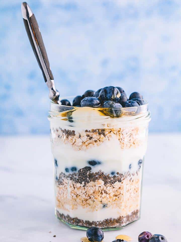 A jar of overnight oats with a spoon