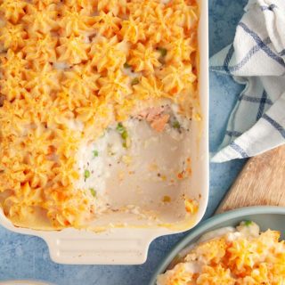 A dish of fish pie on a blue table