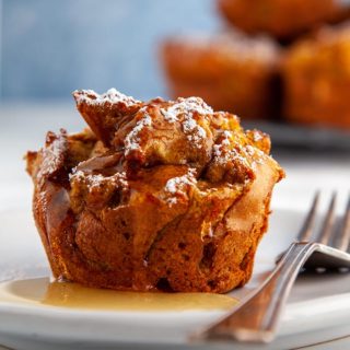 Pumpkin spiced french toast muffin with syrup on a white plate