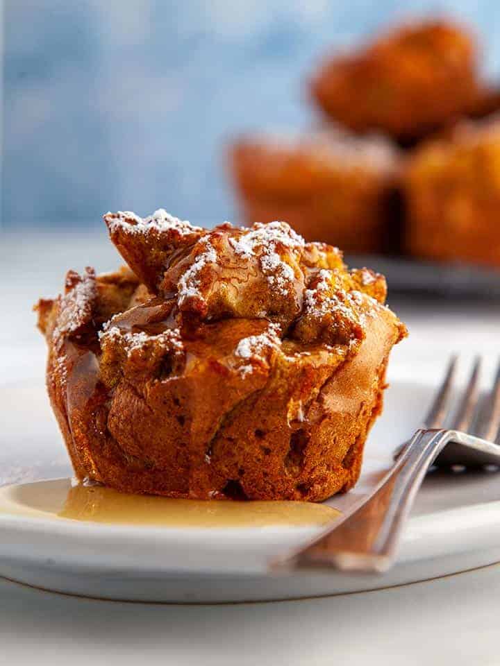 Pumpkin spiced french toast muffin with syrup on a white plate