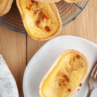 A custard tart on a white plate