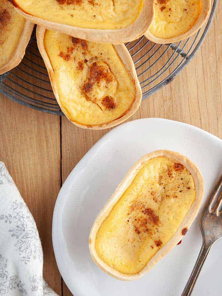 A custard tart on a white plate