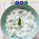 A dish of tzatziki in a blue bowl