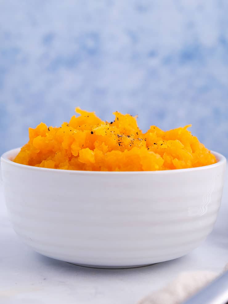 A dish of mash on a white table