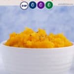 A white dish of mashed butternut squash