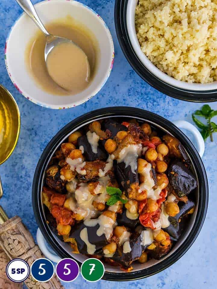 A dish of eggplant and chickpea stew with couscous