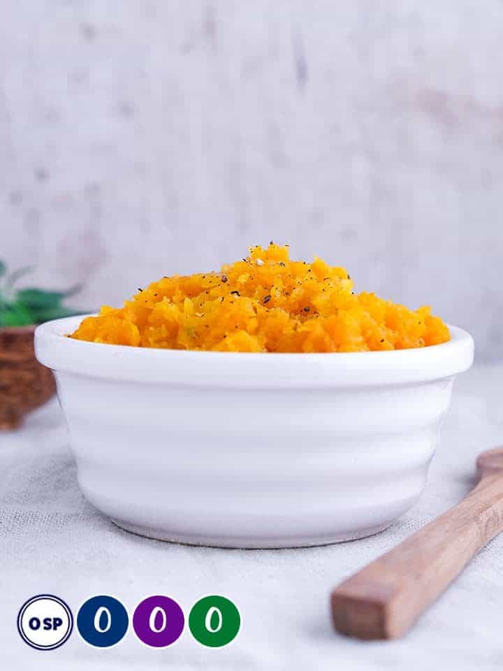 Mashed squash in a white bowl