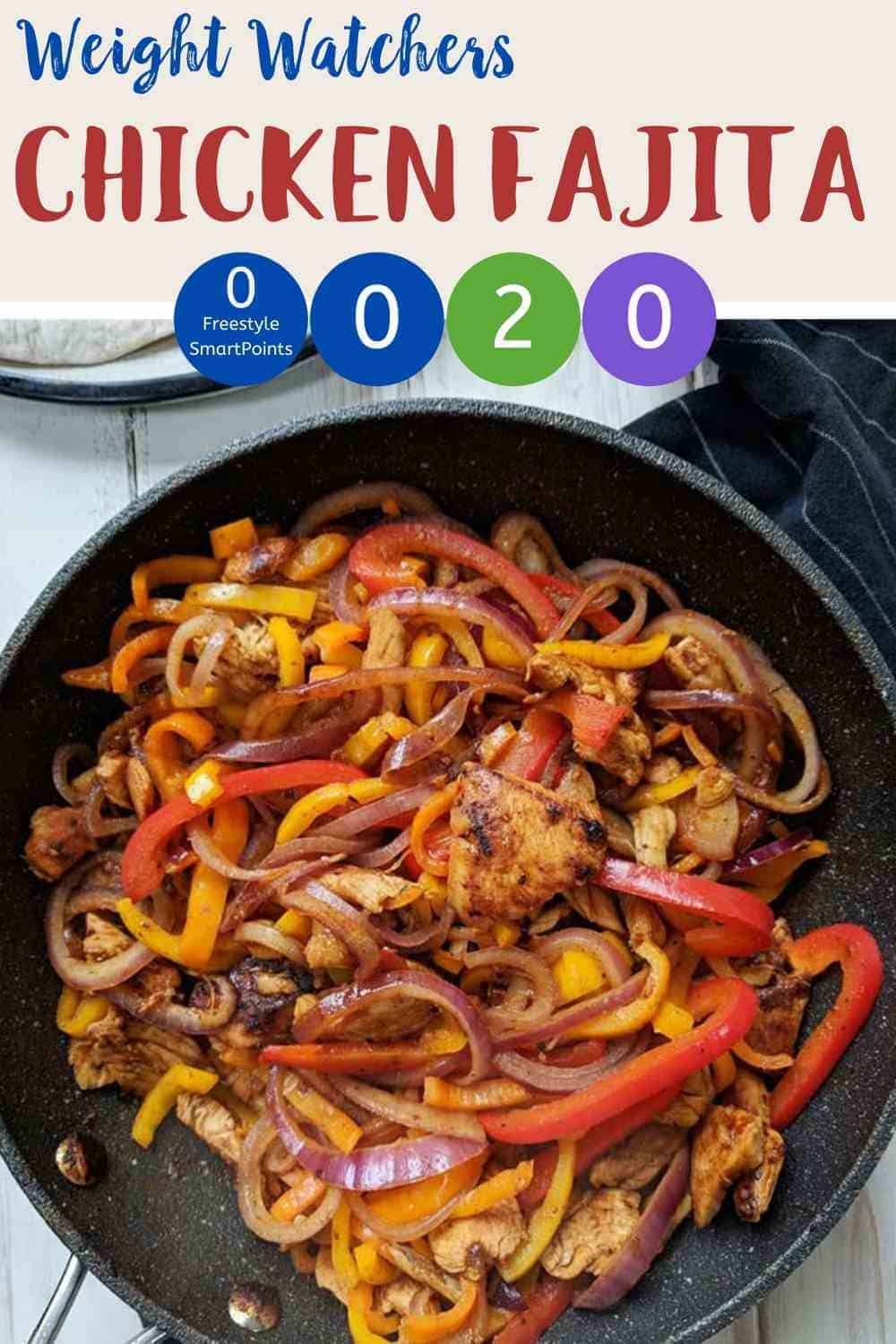 A skillet full of chicken fajitas