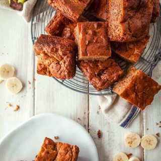 A wire rack with squares on banana cake