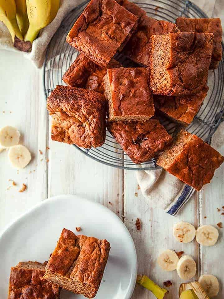 A wire rack with squares on banana cake