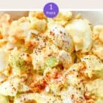 A close up picture of egg salad with a sprinkling of paprika