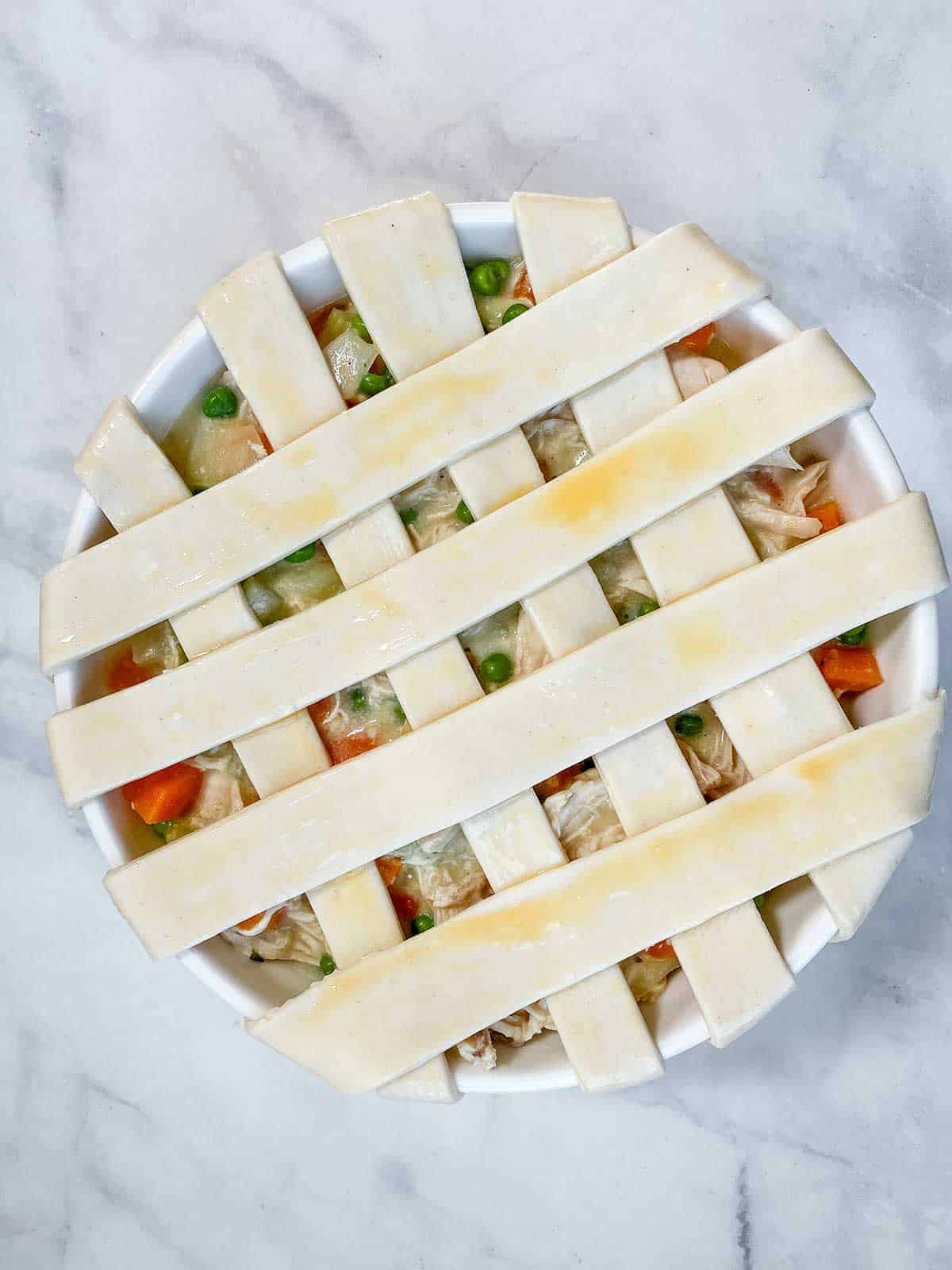 Pastry ribbons on the top of a chicken pot pie