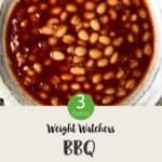 A white ceramic bowl of baked beans with text overlay stating 'Weight Watchers BBQ Baked Beans'.