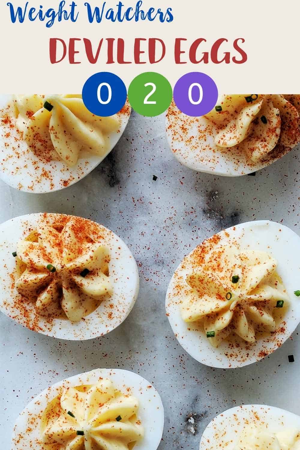 A marble table with 6 deviled eggs dusted with paprika and chives with text overlay stating Weight Watchers Deviled Eggs.