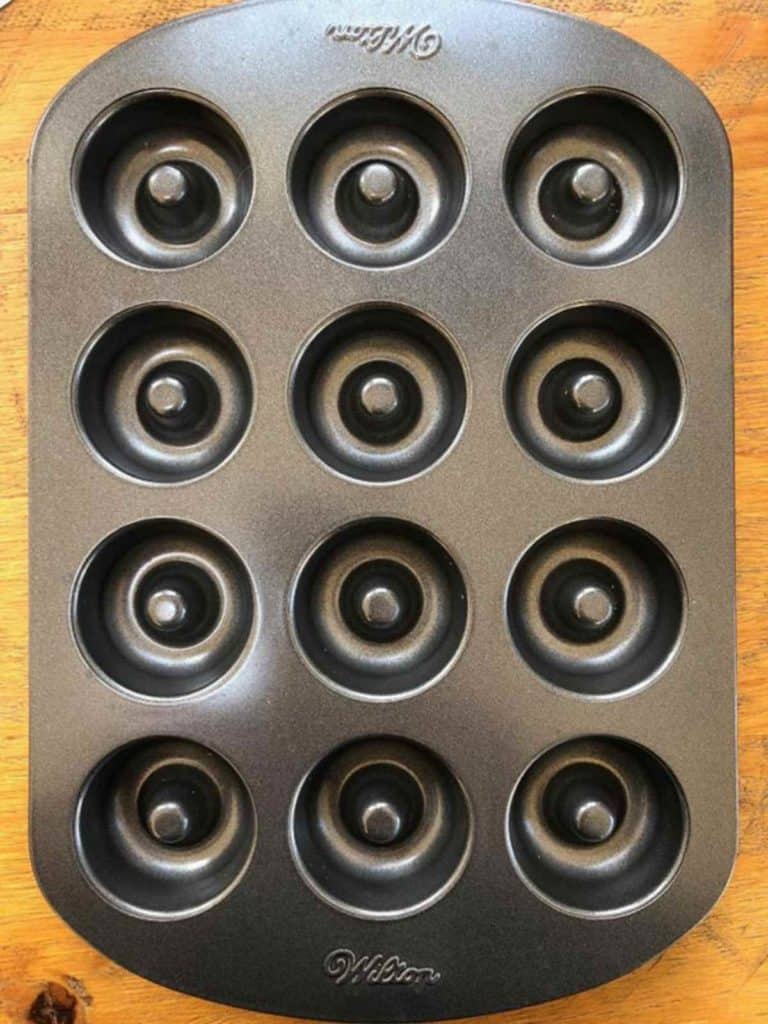 A mini donut pan on a wooden table.