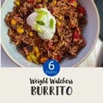 A bowl of burrito mixture topped with yogurt and chopped spring onion on a white table & text overlay 'Weight Watchers Burrito Bowl'.