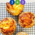 4 cheese scones on a wire rack with text overlay stating WW garlic & cheese scones.