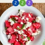 A bowl of watermelon and feta salad with title and counters showing WW smartpoint values.